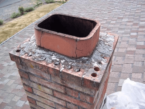 Cracked, deteriorating chimney masonry